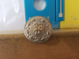 Button P Pullman?  Superior  Silver in color small