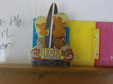 Jaycees California Boy & Girl Surfer Next To A Blue Surfboard  PIN