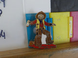 Jaycees Montana Cowboy In Brown Chaps & Yellow Vest Holding Whiskey Bottle .	PIN