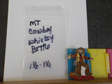 Jaycees Montana Cowboy In Brown Chaps & Yellow Vest Holding Whiskey Bottle .	PIN