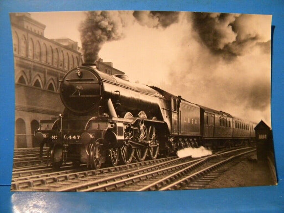 Postcard Flying Scotsman leaving London on a semi-fast train. Real photograph.
