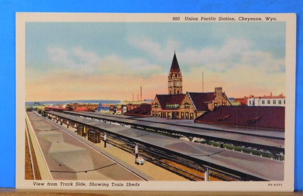 Postcard Union Pacific station Cheyenne Wyoming view from trackside, showing tra